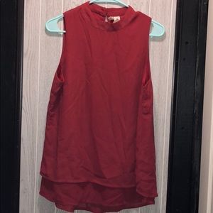 Red sleeveless blouse